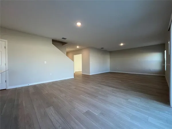 a view of room and wooden floor