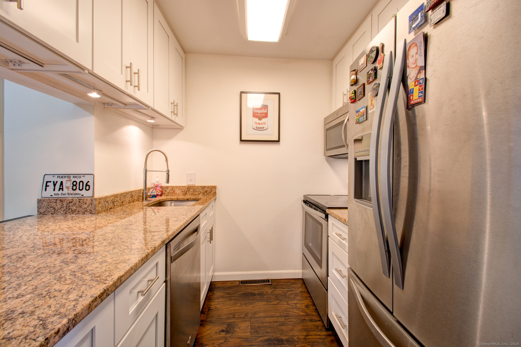184 Gravel Street, Unit 26 Meriden, CT 06450 - Photo 6 of 27 a kitchen with stainless steel appliances granite countertop a refrigerator and a sink