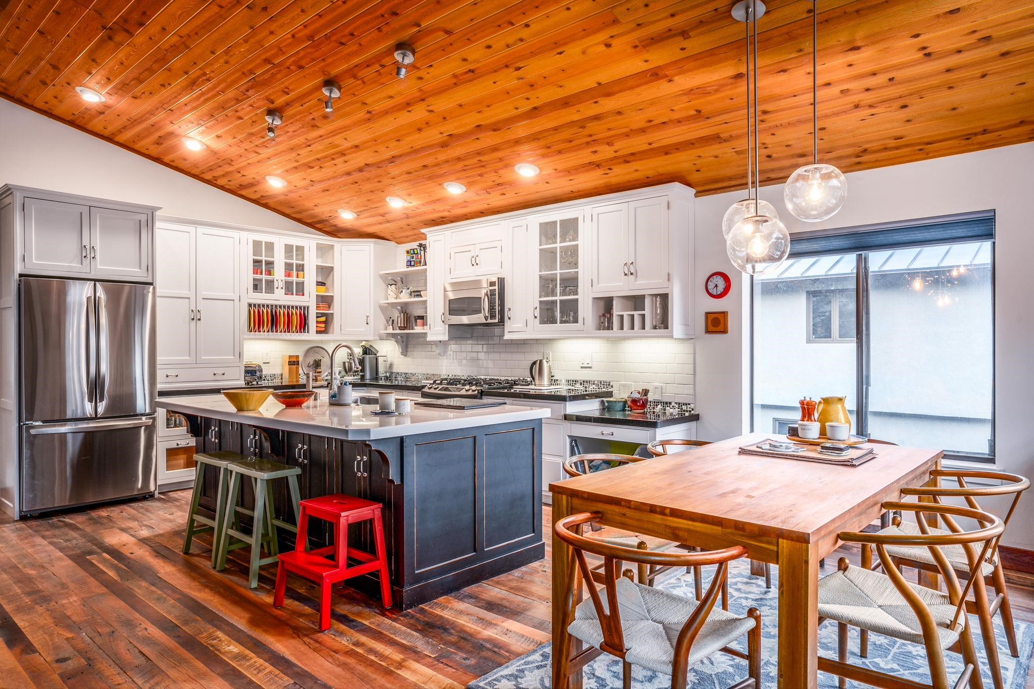 a kitchen with stainless steel appliances granite countertop a stove and refrigerator