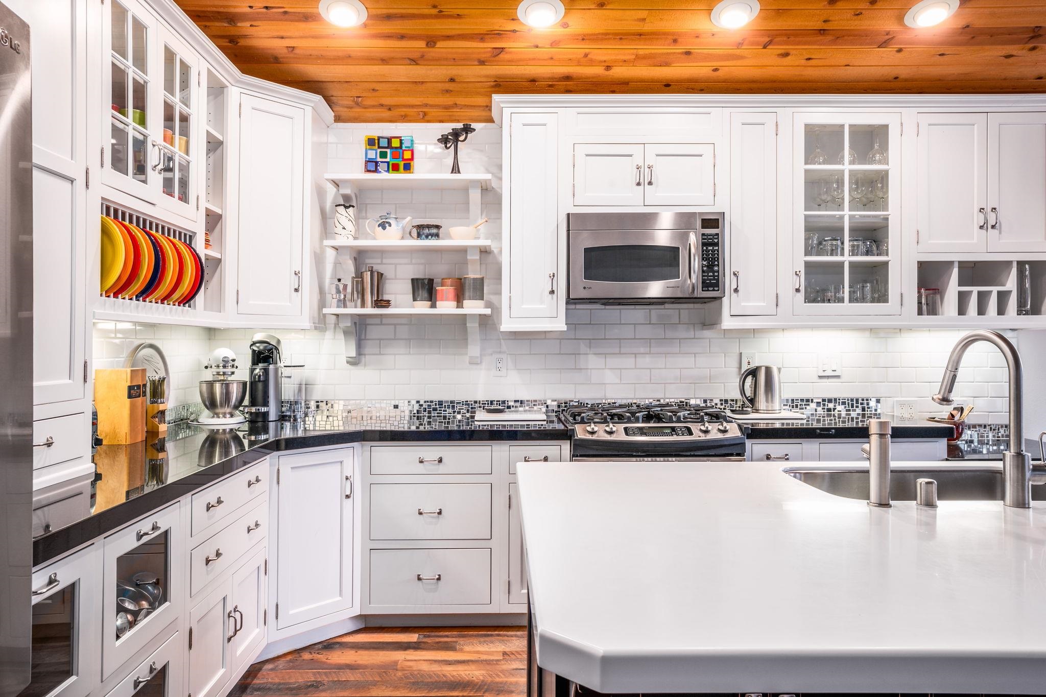 2 Holiday Way Mammoth Lakes, CA 93546 - Photo 2 of 37 a kitchen with stainless steel appliances granite countertop a stove a sink and a microwave