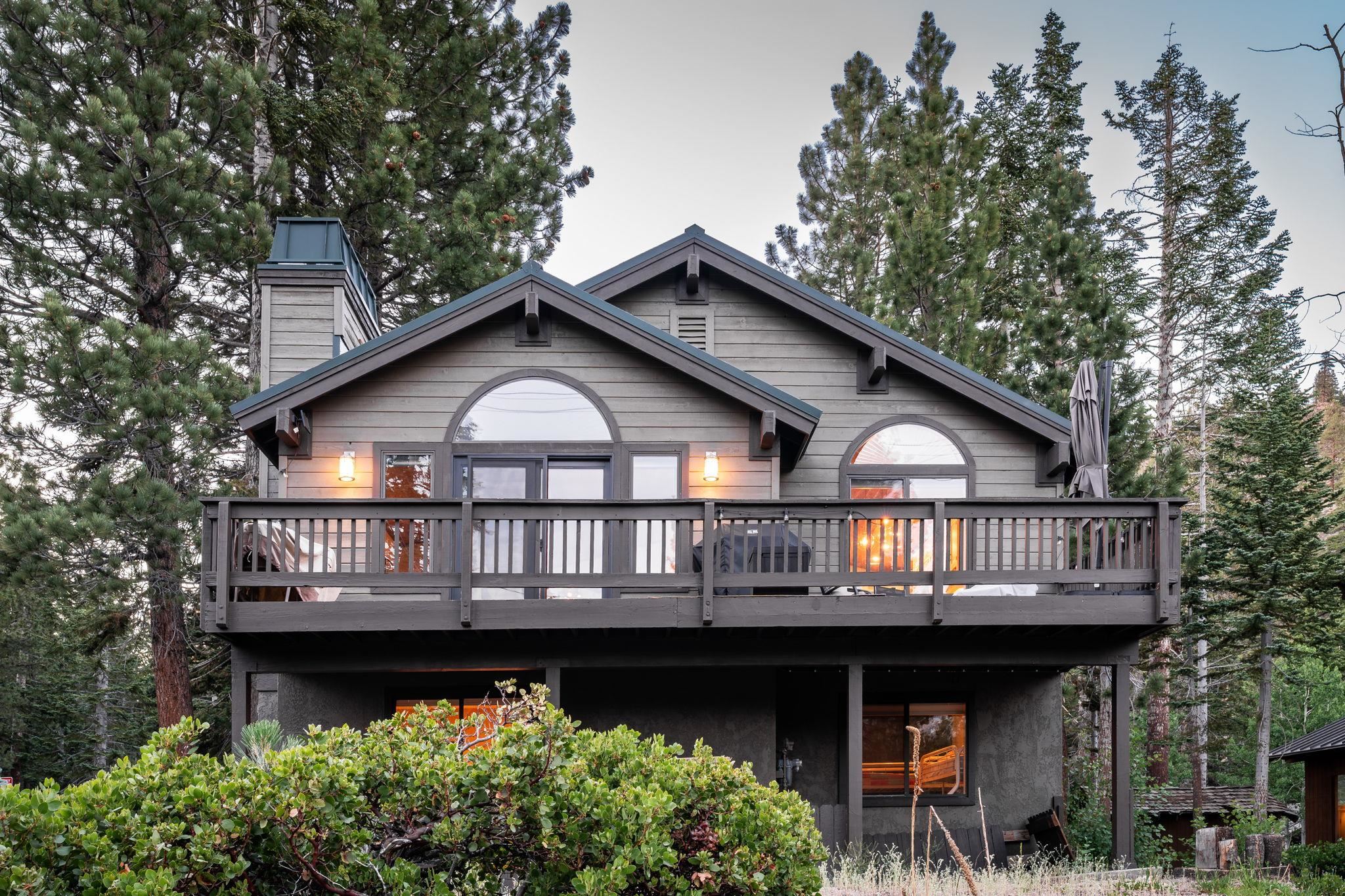 2 Holiday Way Mammoth Lakes, CA 93546 - Photo 24 of 37 a view of house with swimming pool and trees in the background