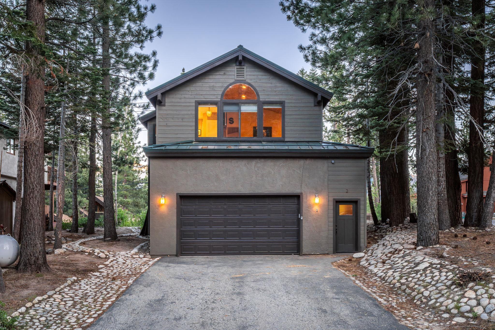 2 Holiday Way Mammoth Lakes, CA 93546 - Photo 27 of 37 a front view of a house with a yard and garage