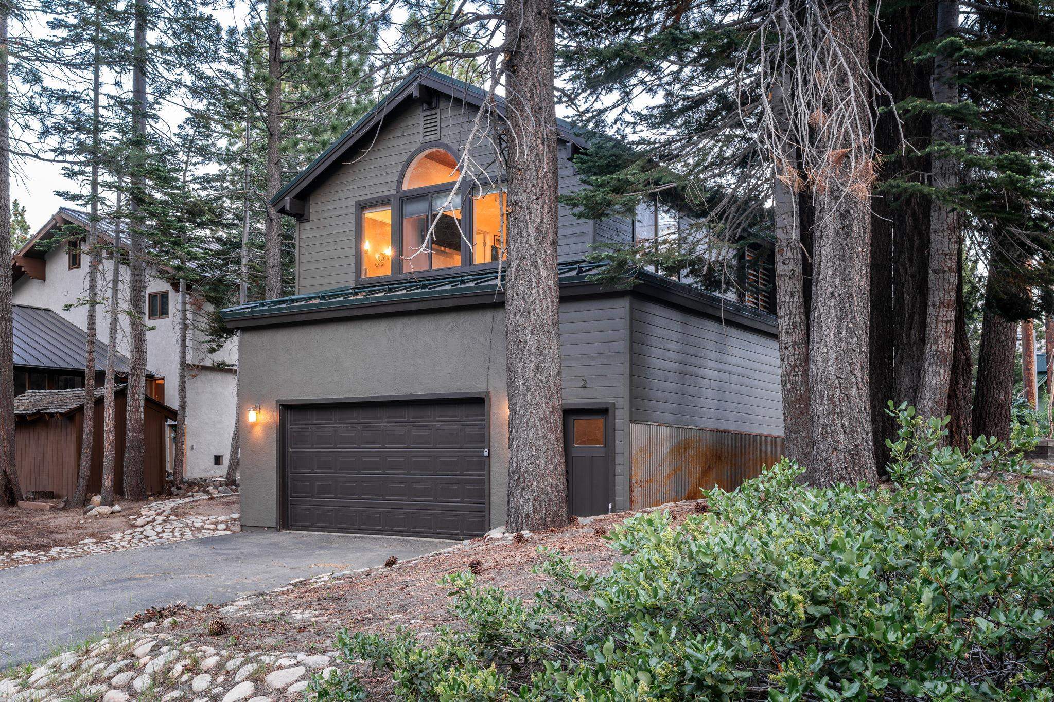 2 Holiday Way Mammoth Lakes, CA 93546 - Photo 29 of 37 a front view of a house with a yard and garage