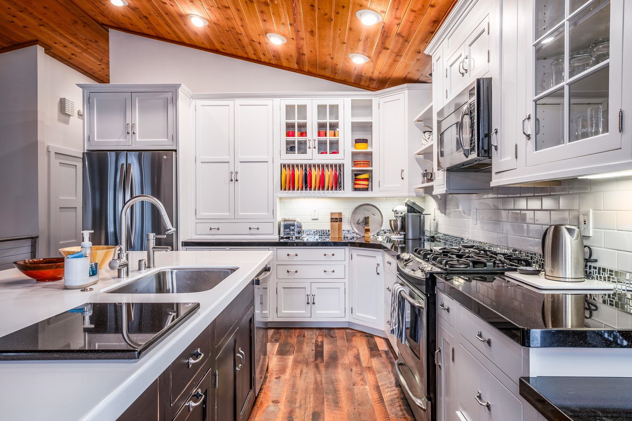 2 Holiday Way Mammoth Lakes, CA 93546 - Photo 3 of 37 a kitchen with stainless steel appliances granite countertop a sink stove and cabinets