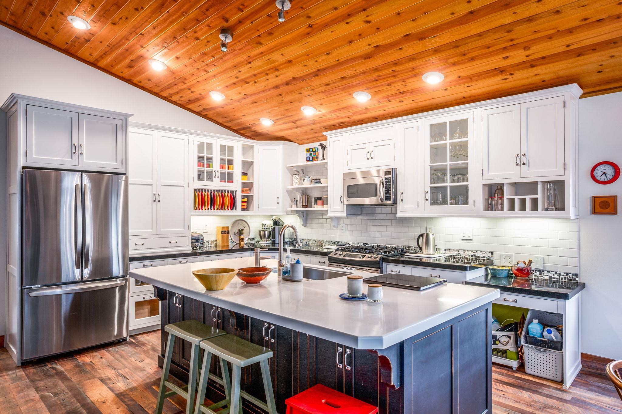 2 Holiday Way Mammoth Lakes, CA 93546 - Photo 5 of 37 a kitchen with stainless steel appliances granite countertop a sink a stove and refrigerator