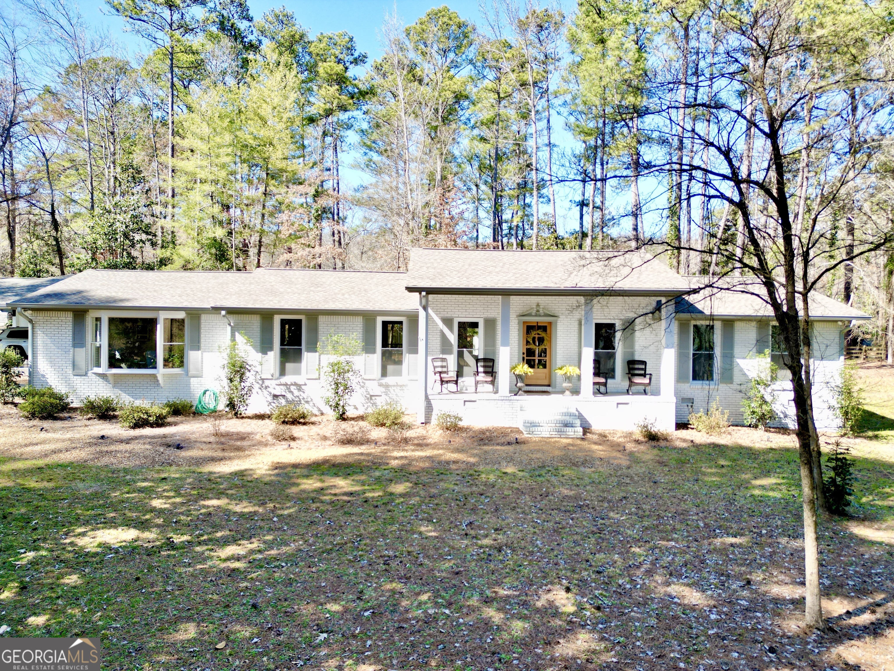 2 Huntington Road Southwest Rome, GA 30165 - Photo 1 of 1 a front view of a house with yard patio and fire pit