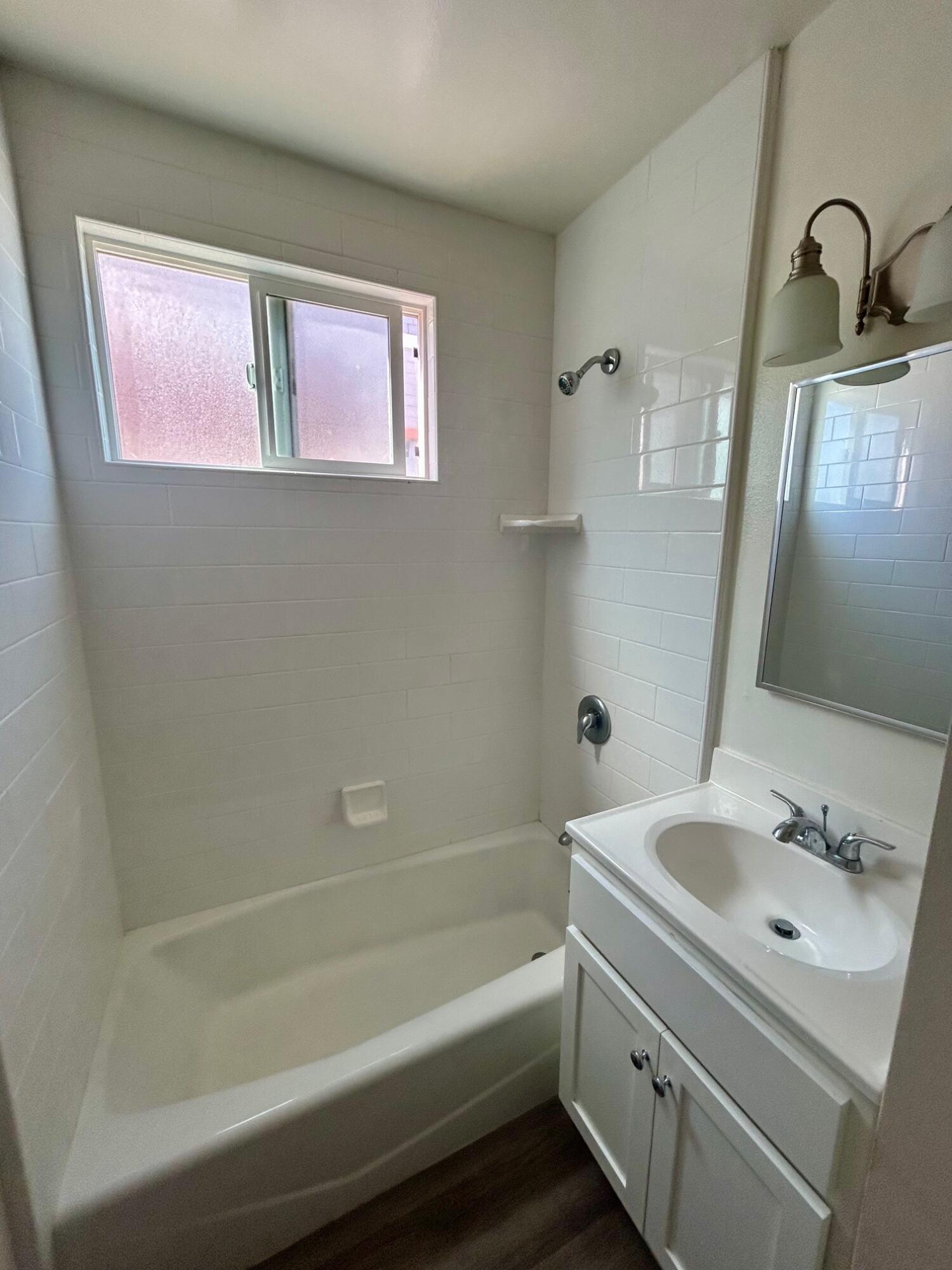 326 West Anapamu Street, Unit B Santa Barbara, CA 93101 - Photo 5 of 5 a bathroom with a tub sink and mirror