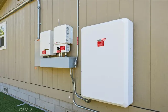 a view of a house with a yard and sitting area