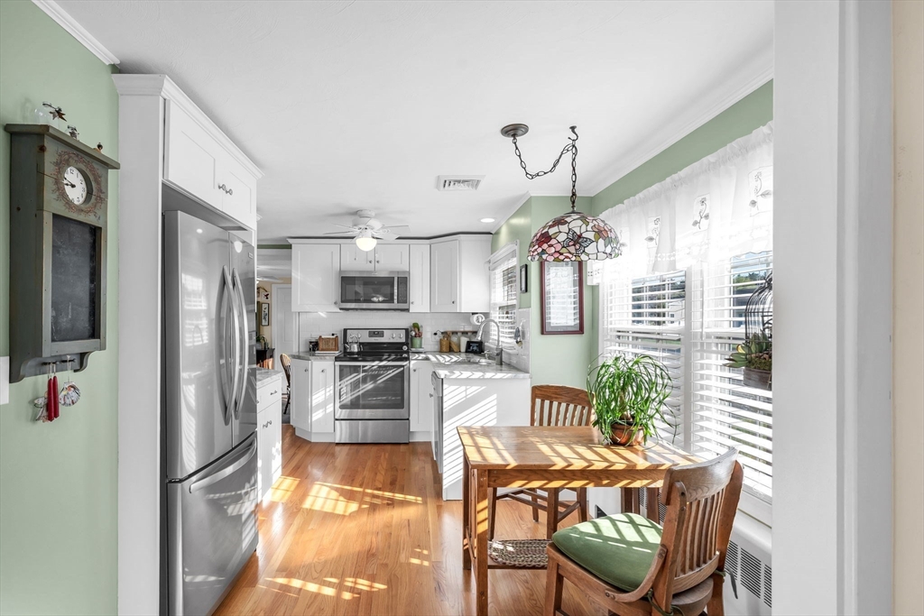 34 Adams Street Ludlow, MA 01056 - Photo 11 of 42 a view of a dining room with furniture window and wooden floor