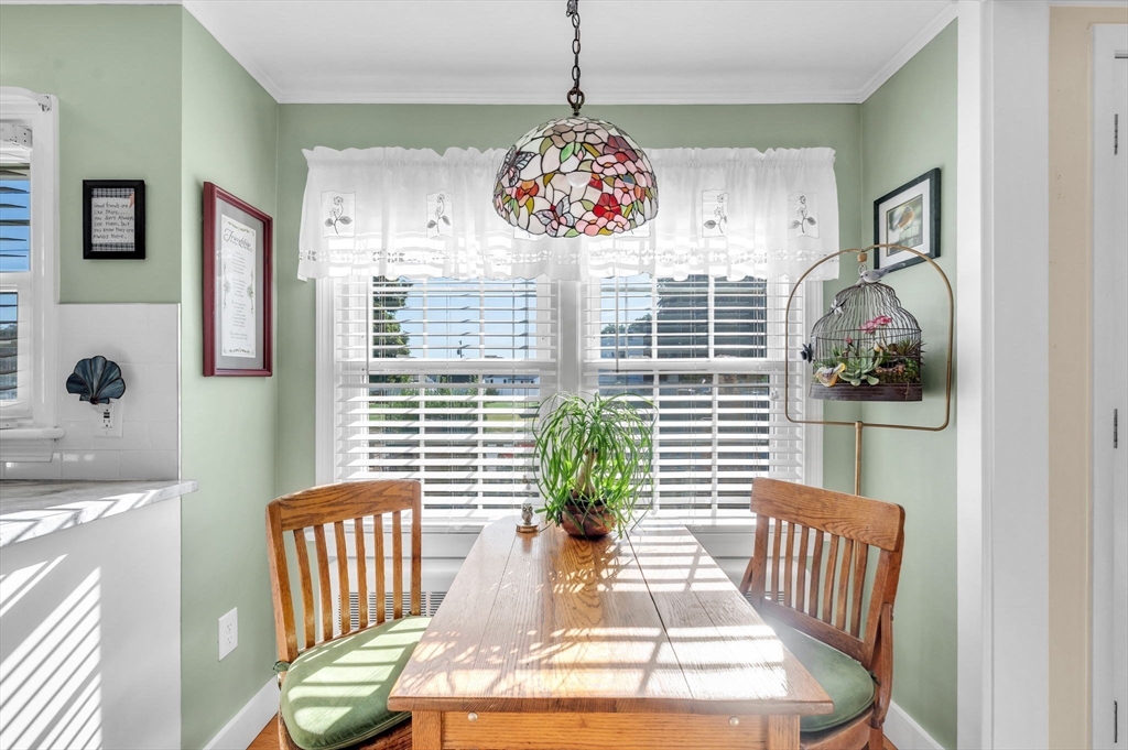 34 Adams Street Ludlow, MA 01056 - Photo 12 of 42 a view of a dining room with furniture wooden floor and windows