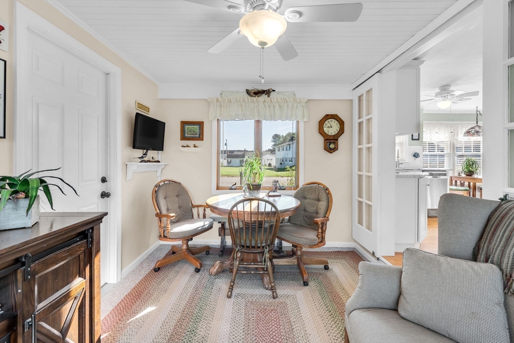 34 Adams Street Ludlow, MA 01056 - Photo 18 of 42 a living room with furniture a fireplace and a flat screen tv