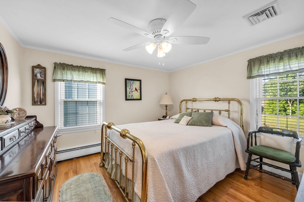 34 Adams Street Ludlow, MA 01056 - Photo 25 of 42 a bedroom with a bed and a chandelier