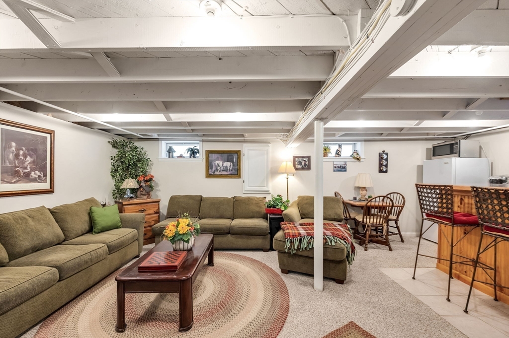 34 Adams Street Ludlow, MA 01056 - Photo 31 of 42 a living room with furniture and a large window