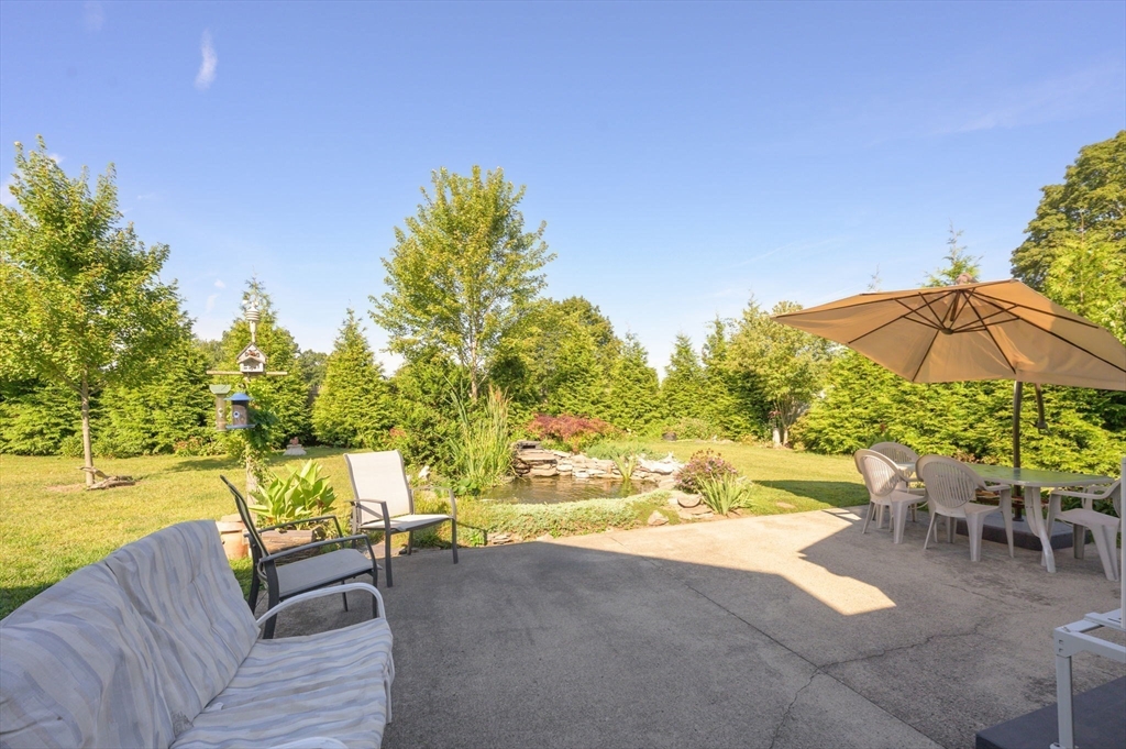 34 Adams Street Ludlow, MA 01056 - Photo 38 of 42 a view of a swimming pool with a patio