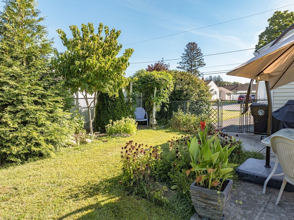 34 Adams Street Ludlow, MA 01056 - Photo 40 of 42 a view of a backyard with sitting area