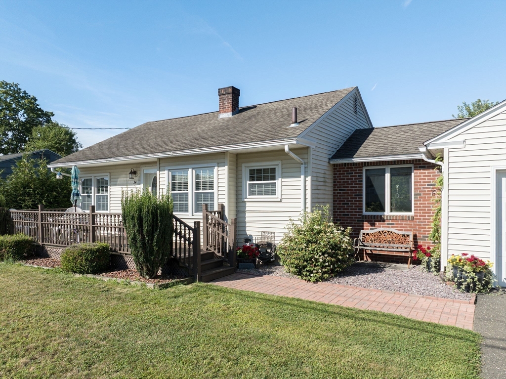 34 Adams Street Ludlow, MA 01056 - Photo 5 of 42 a house view with a garden space