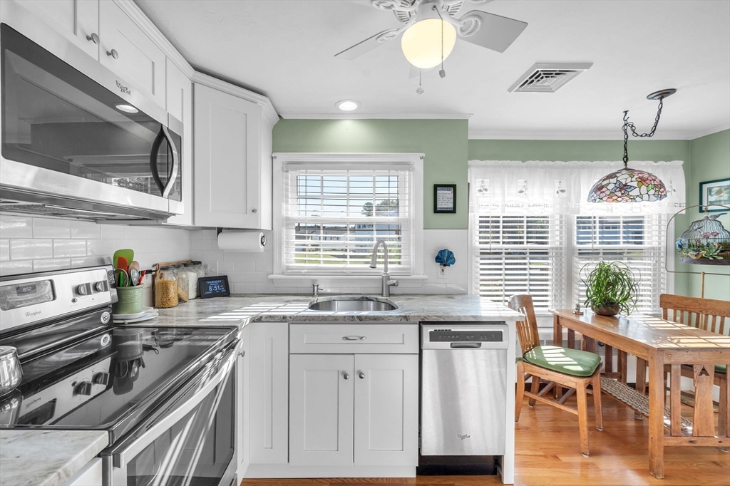 34 Adams Street Ludlow, MA 01056 - Photo 10 of 42 a kitchen with stove a sink and cabinets