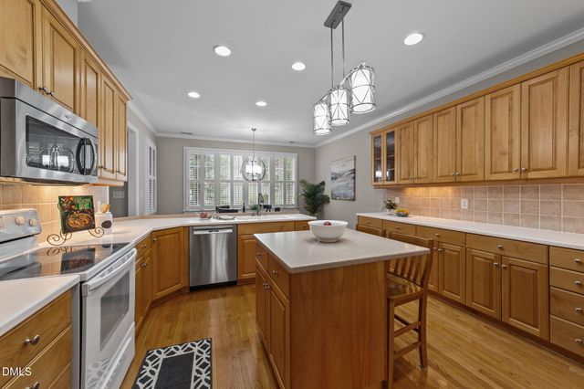 a living room with furniture a fireplace and a window