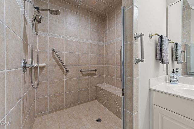 a bathroom with a shower and a sink