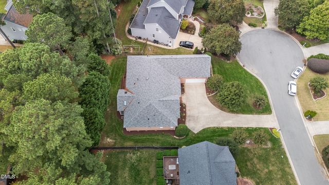 an aerial view of a house with outdoor space and a lake view