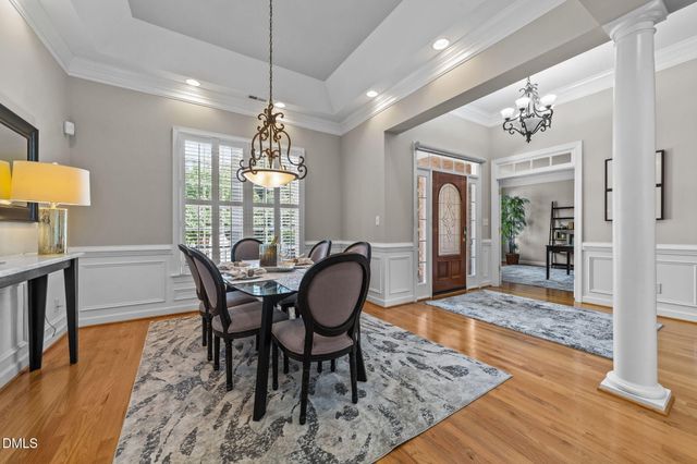a view of a dining room with furniture and window