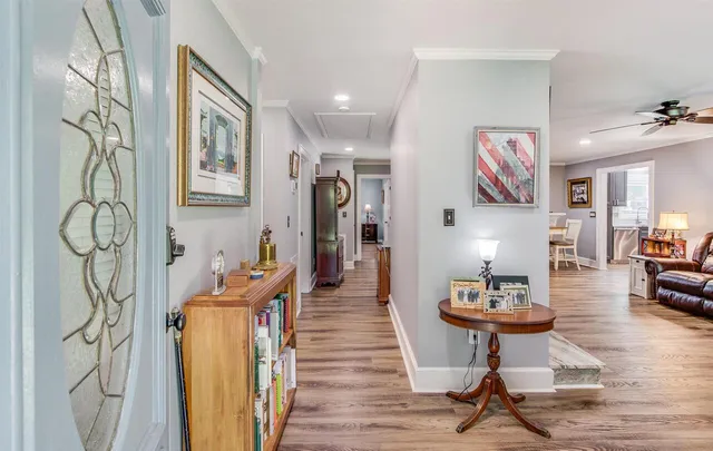 a very nice looking room with a wooden floor and furniture