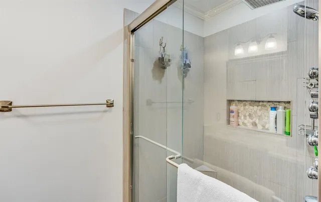 a bathroom with a shower and a sink