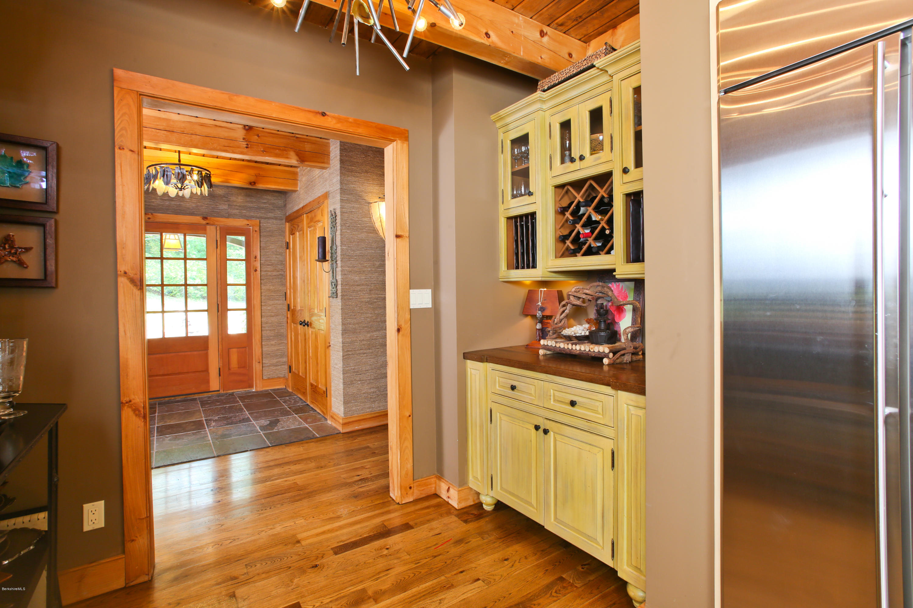 9 Mt Hunger Road Monterey, MA 01245 - Photo 17 of 44 a hallway with sliding door and wooden floor