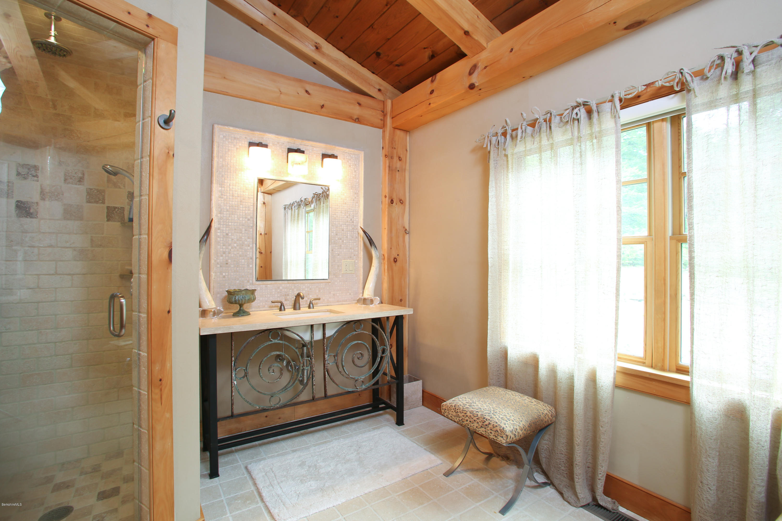9 Mt Hunger Road Monterey, MA 01245 - Photo 20 of 44 a spacious bathroom with a granite countertop sink and a mirror