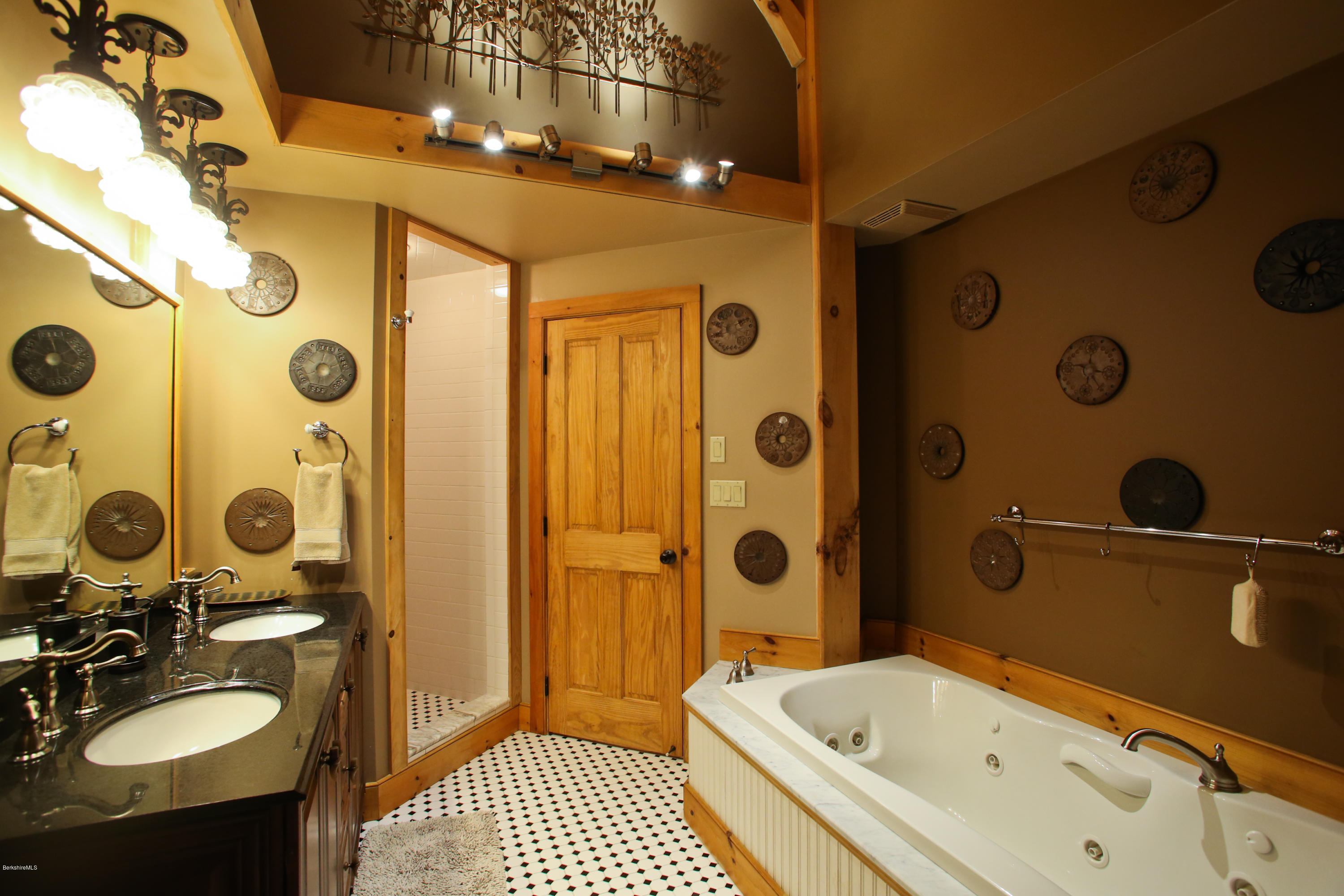 9 Mt Hunger Road Monterey, MA 01245 - Photo 26 of 44 a bathroom with a tub a sink and mirror