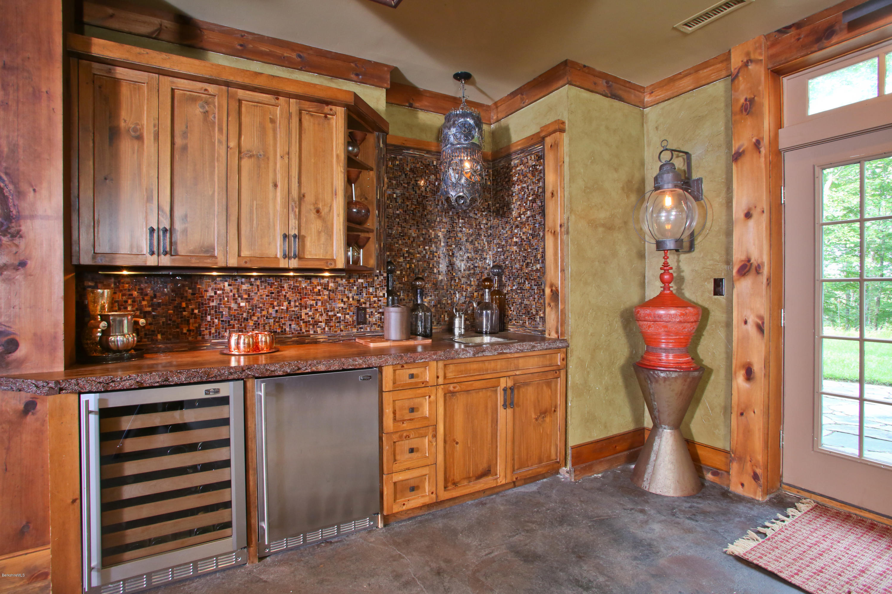 9 Mt Hunger Road Monterey, MA 01245 - Photo 30 of 44 a view of a entryway with kitchen and chandelier