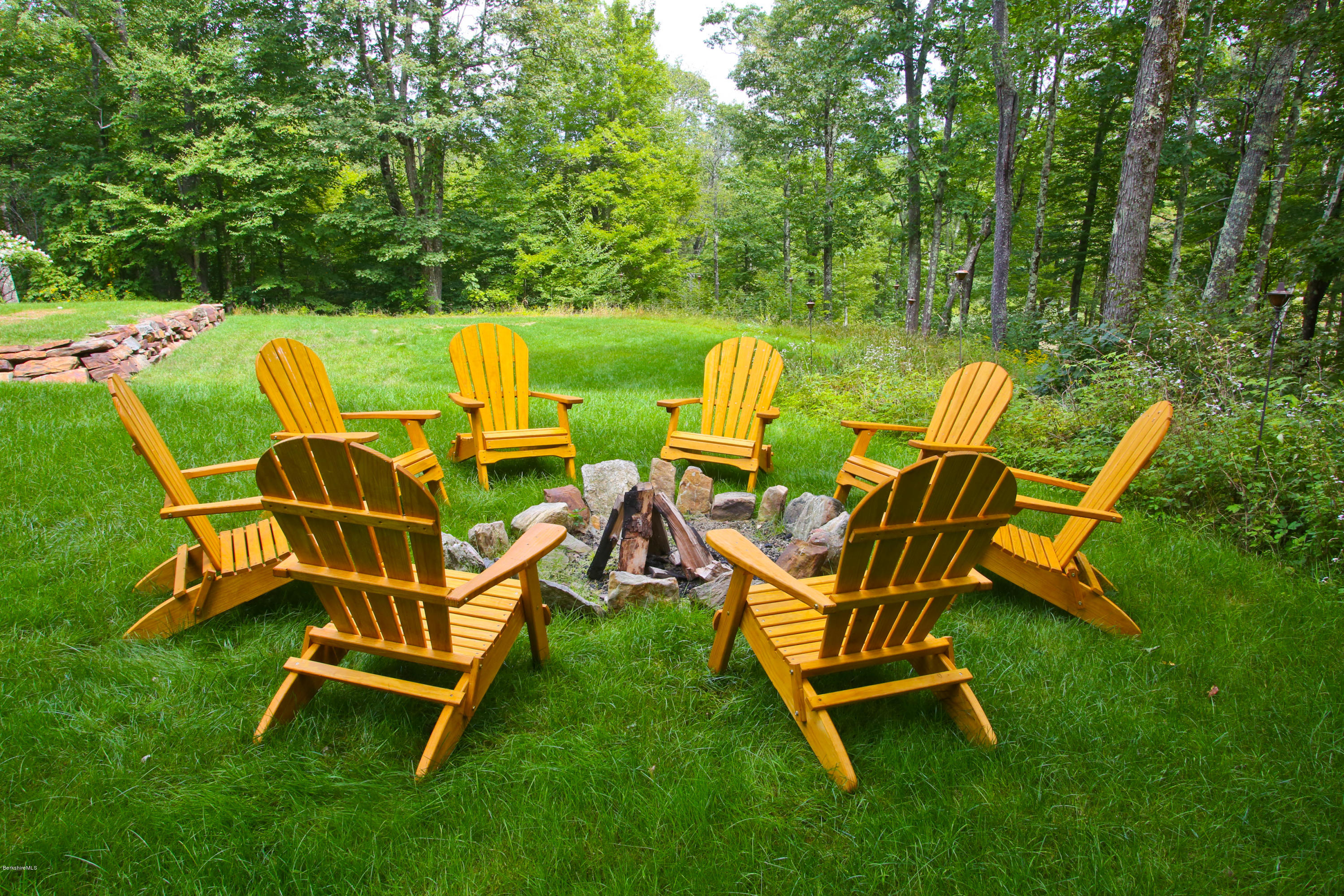 9 Mt Hunger Road Monterey, MA 01245 - Photo 33 of 44 a view of a swimming pool with chairs and backyard