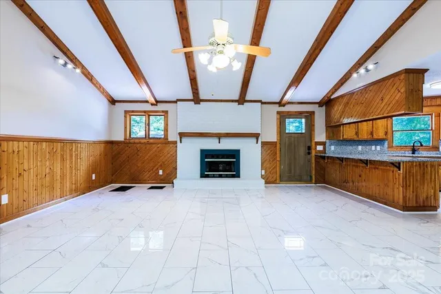 a view of an empty room with a fireplace