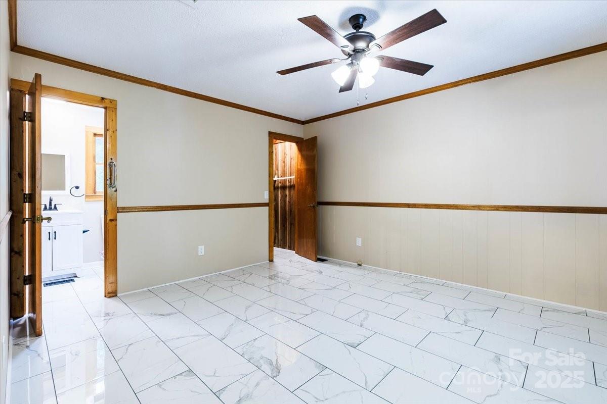 200 Lakeview Road Albemarle, NC 28001 - Photo 9 of 11 a view of a big room with wooden floor and a ceiling fan