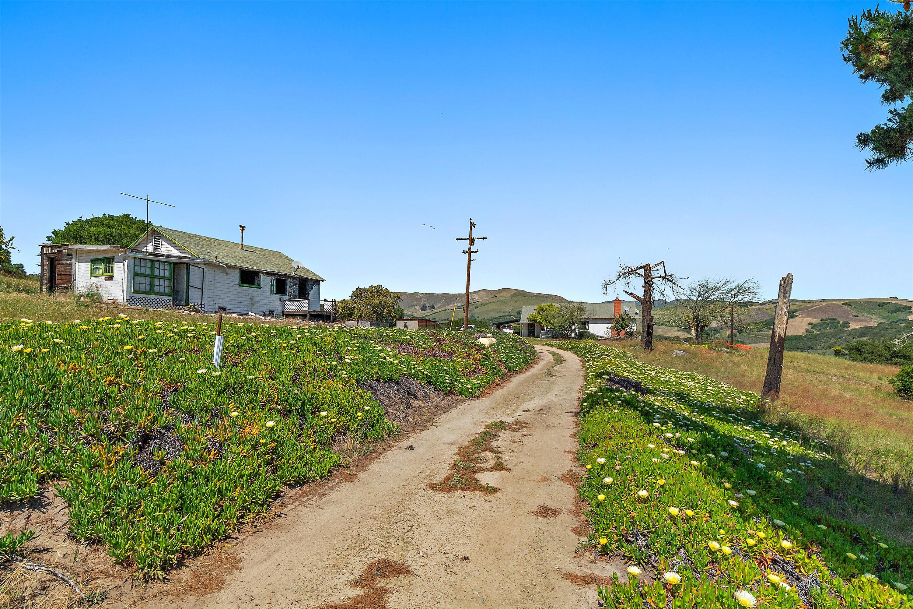 6060 Highway 246 Lompoc, CA 93436 - Photo 2 of 39 a view of a lake with a building in the background