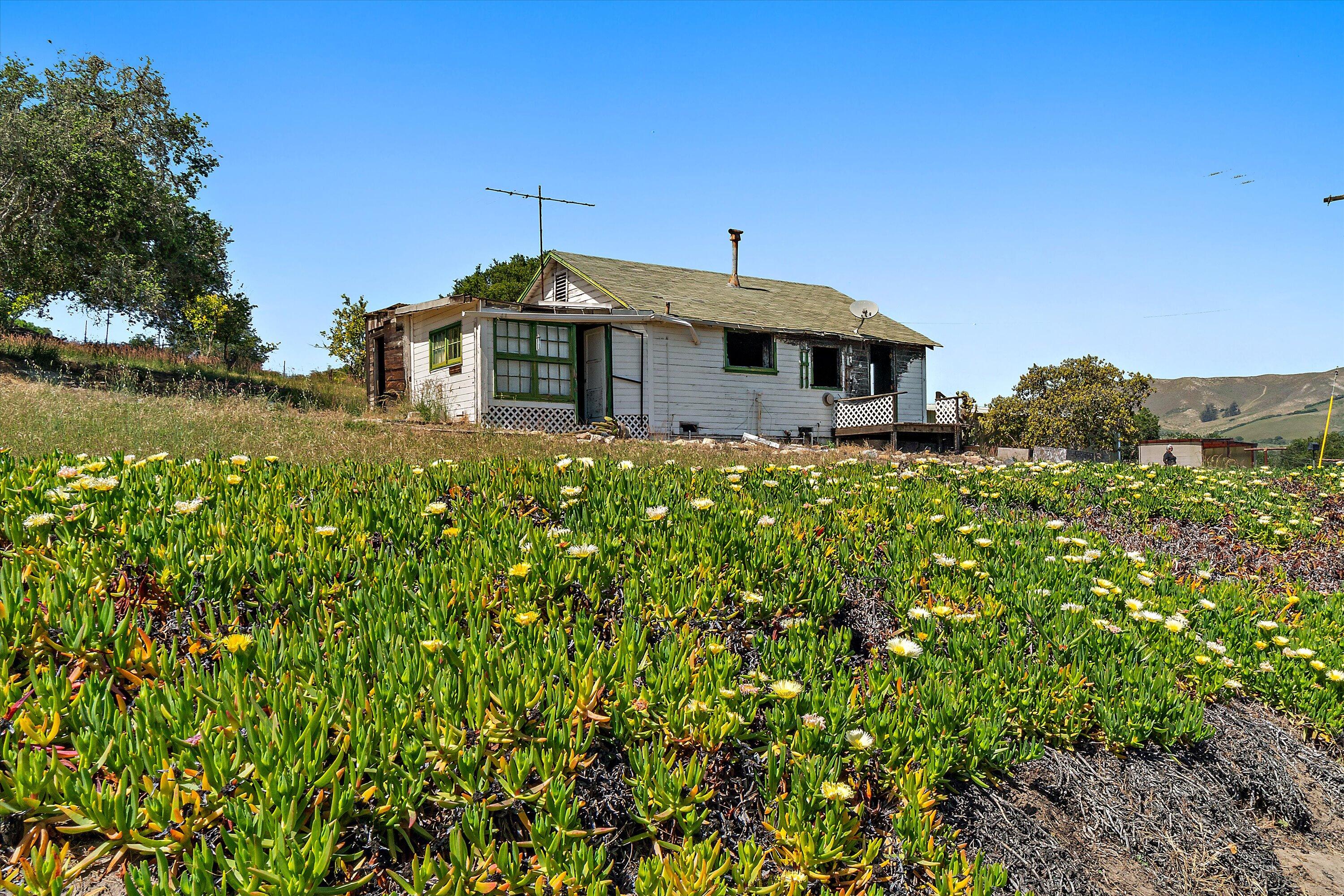 6060 Highway 246 Lompoc, CA 93436 - Photo 3 of 39 a front view of a house with a yard