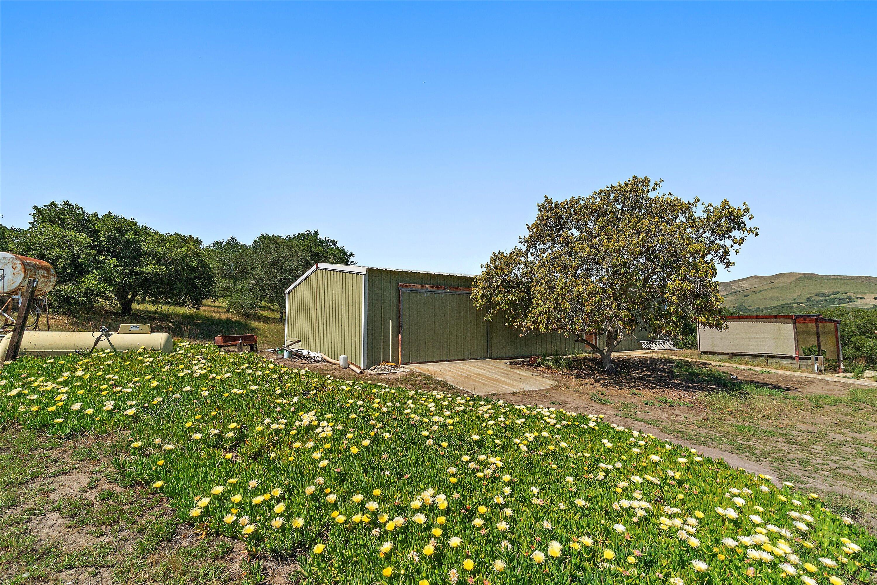 6060 Highway 246 Lompoc, CA 93436 - Photo 10 of 39 a backyard of a house with lots of green space