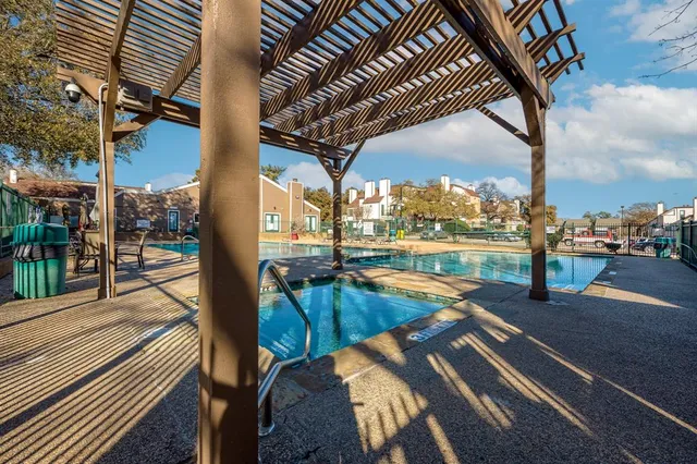 a view of a swimming pool with a patio