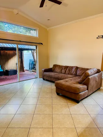 a living room with a couch and a rug