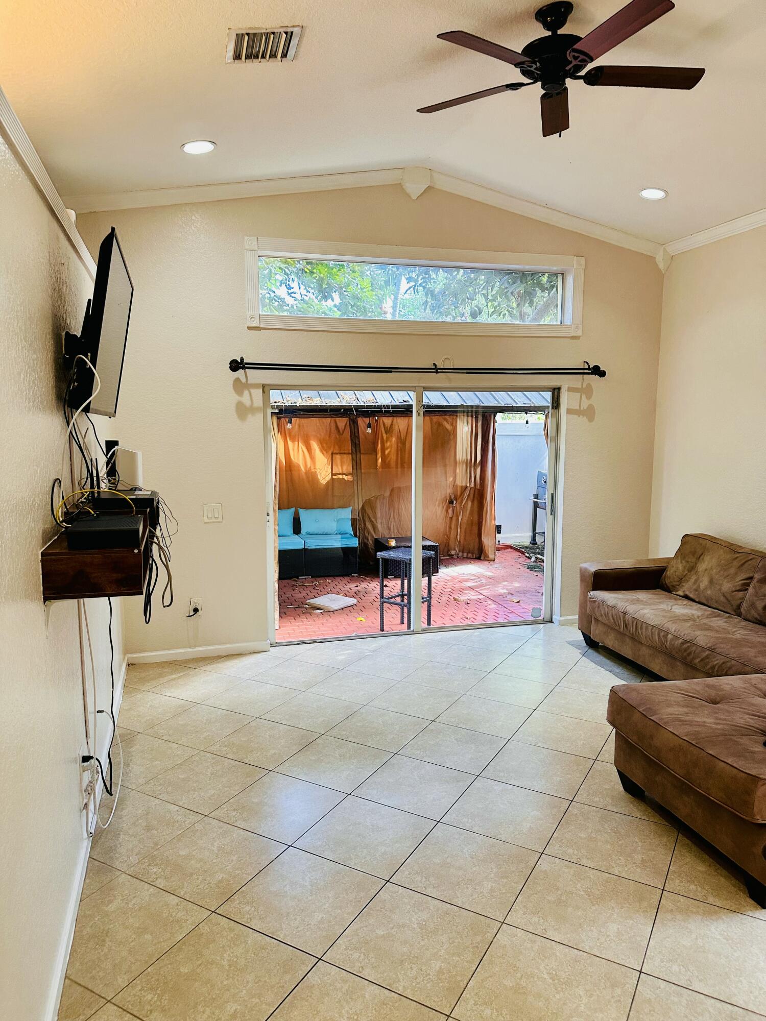 5200 Rising Comet Lane Greenacres, FL 33463 - Photo 18 of 50 a living room with furniture and a flat screen tv
