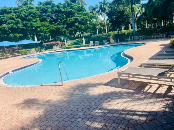 a view of a swimming pool with a patio