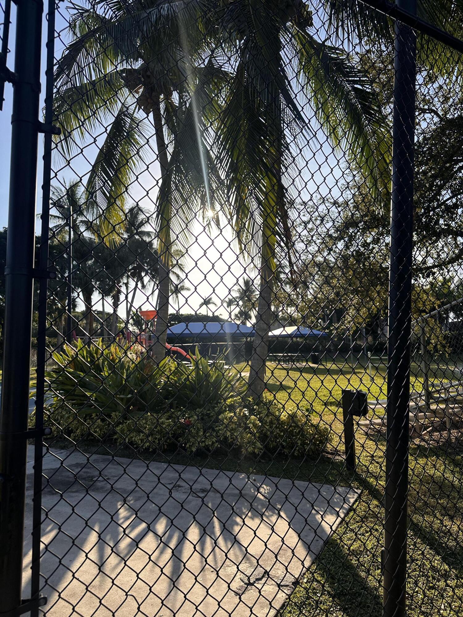 5200 Rising Comet Lane Greenacres, FL 33463 - Photo 40 of 50 a view of a pathway with a yard