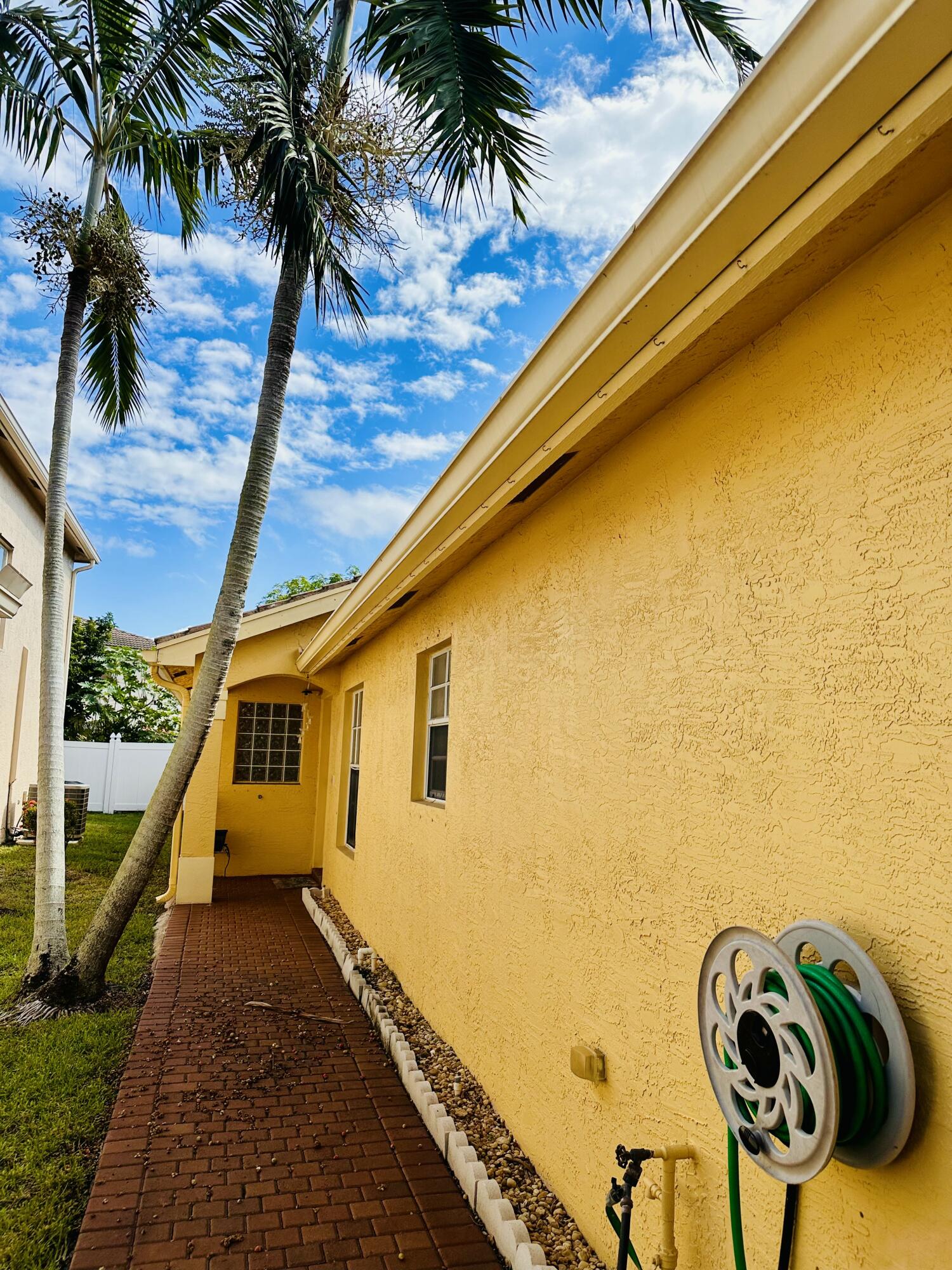 5200 Rising Comet Lane Greenacres, FL 33463 - Photo 4 of 50 a view of a patio with wooden floor