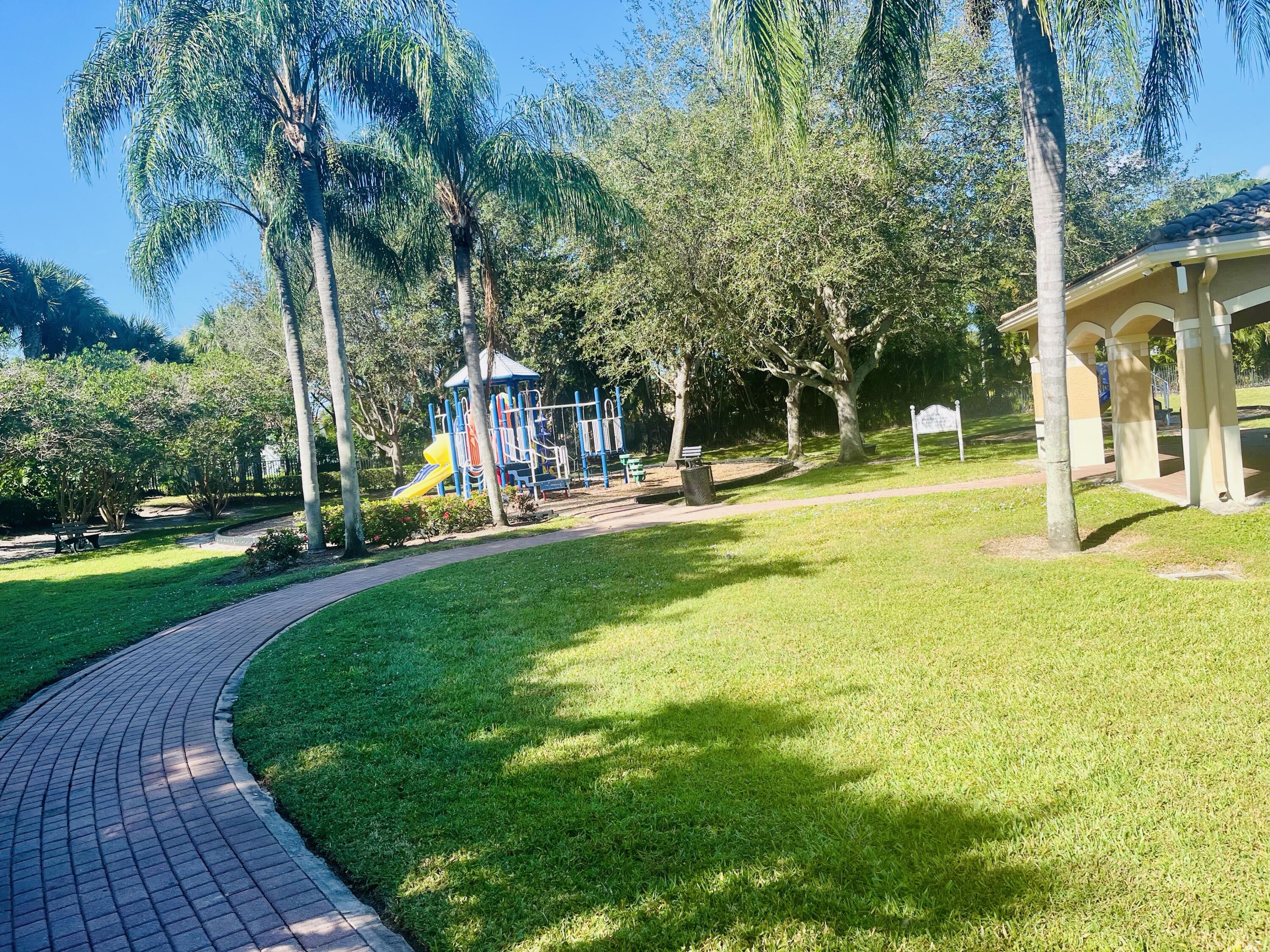 5200 Rising Comet Lane Greenacres, FL 33463 - Photo 45 of 50 a view of a playground with a slide