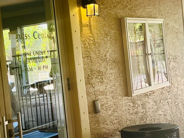 a view of a door and a window