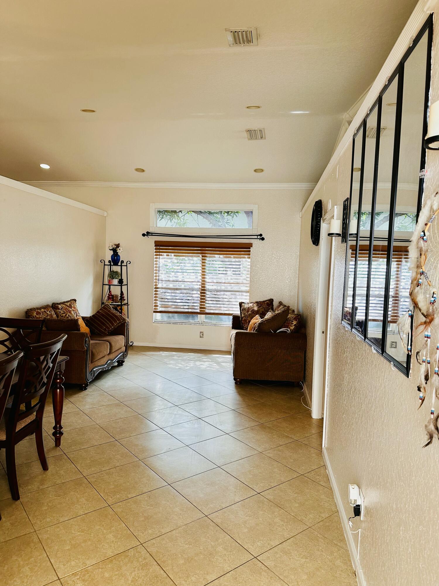 5200 Rising Comet Lane Greenacres, FL 33463 - Photo 5 of 50 a living room with furniture and a window