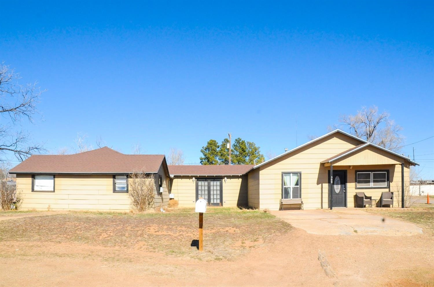 309 Ranch Street Ropesville, TX 79358 - Photo 1 of 26 a front view of a house with a yard