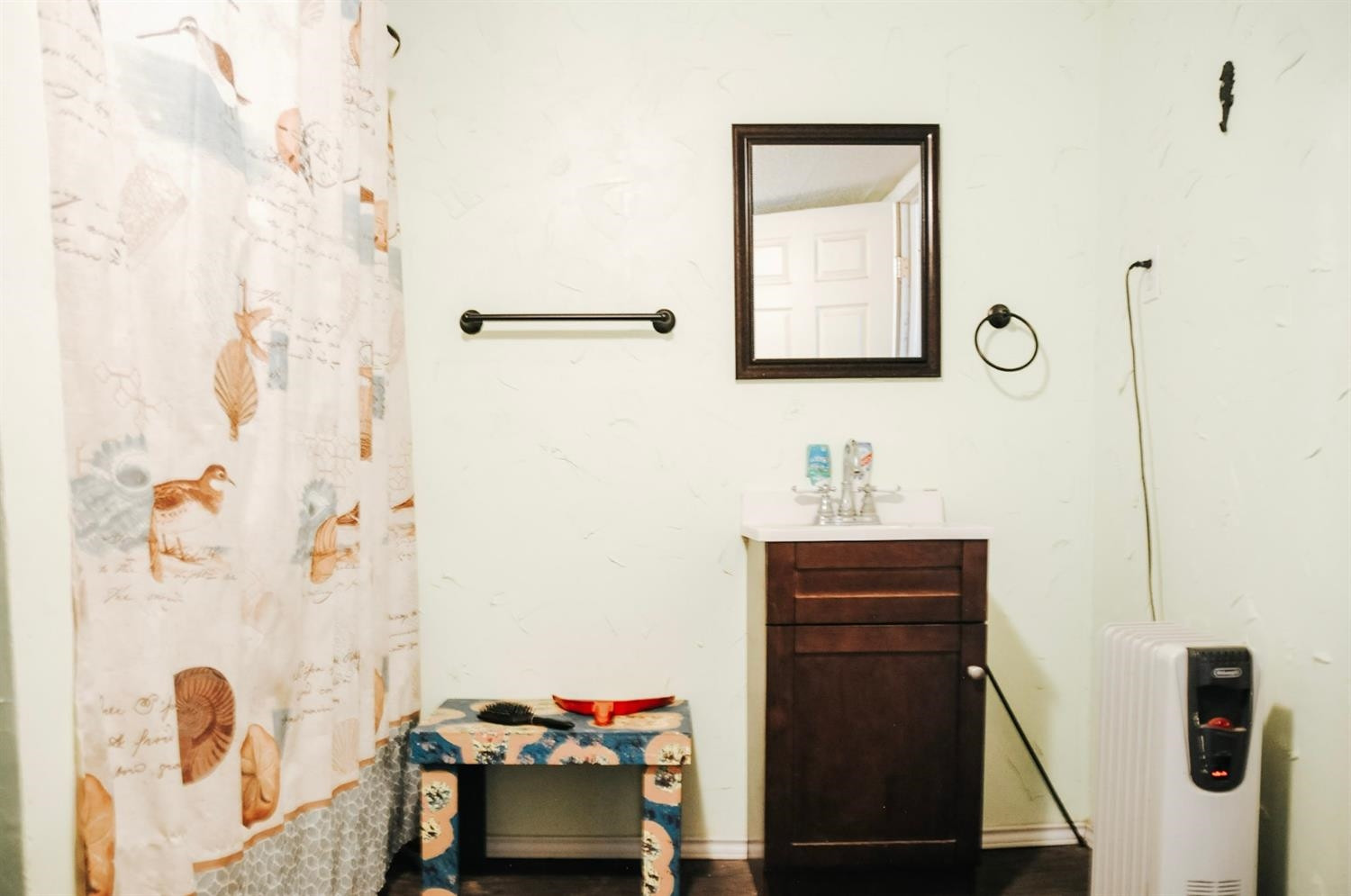 309 Ranch Street Ropesville, TX 79358 - Photo 18 of 26 a bathroom with a sink and a mirror