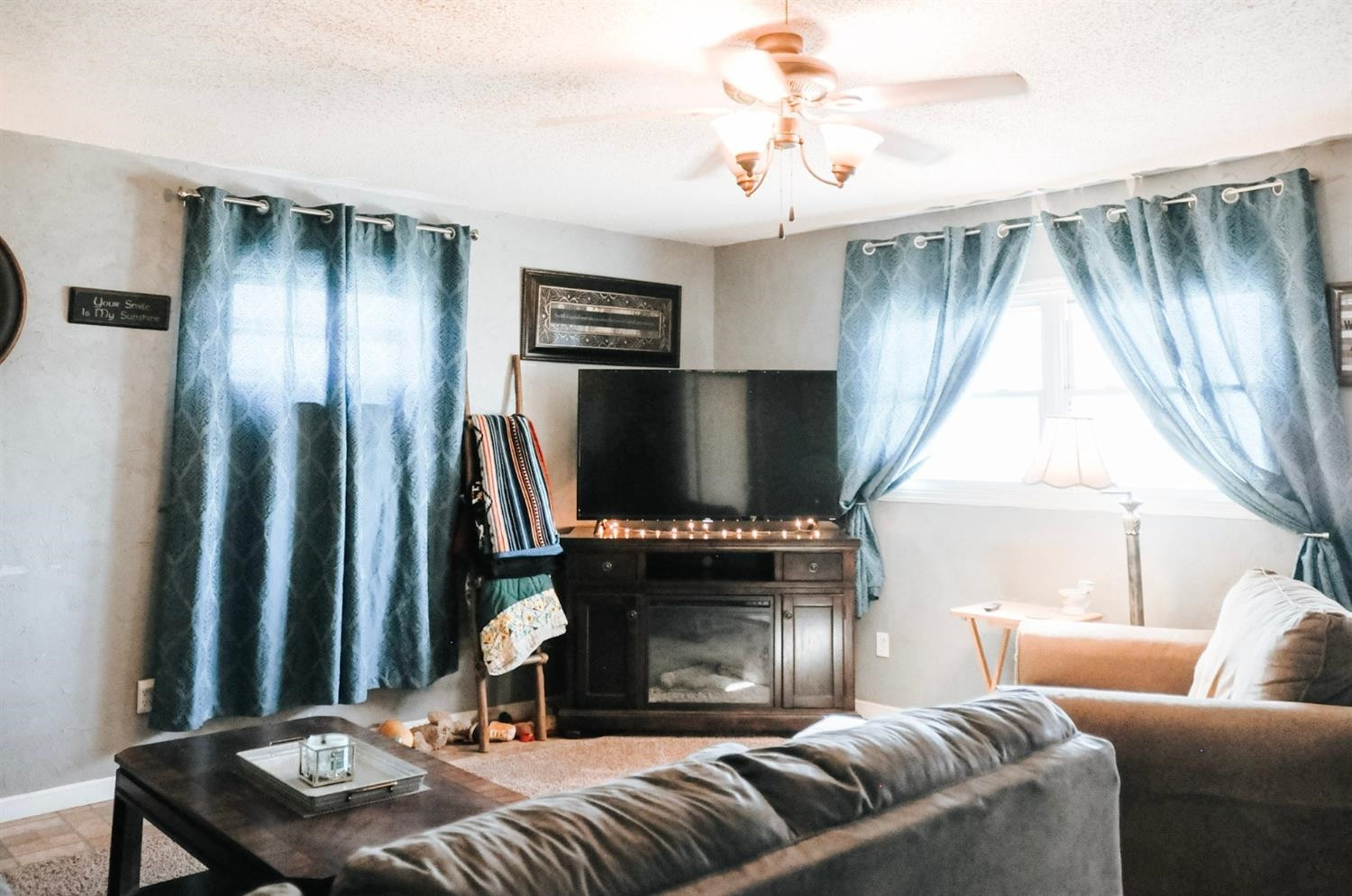 309 Ranch Street Ropesville, TX 79358 - Photo 2 of 26 a living room with furniture and a flat screen tv
