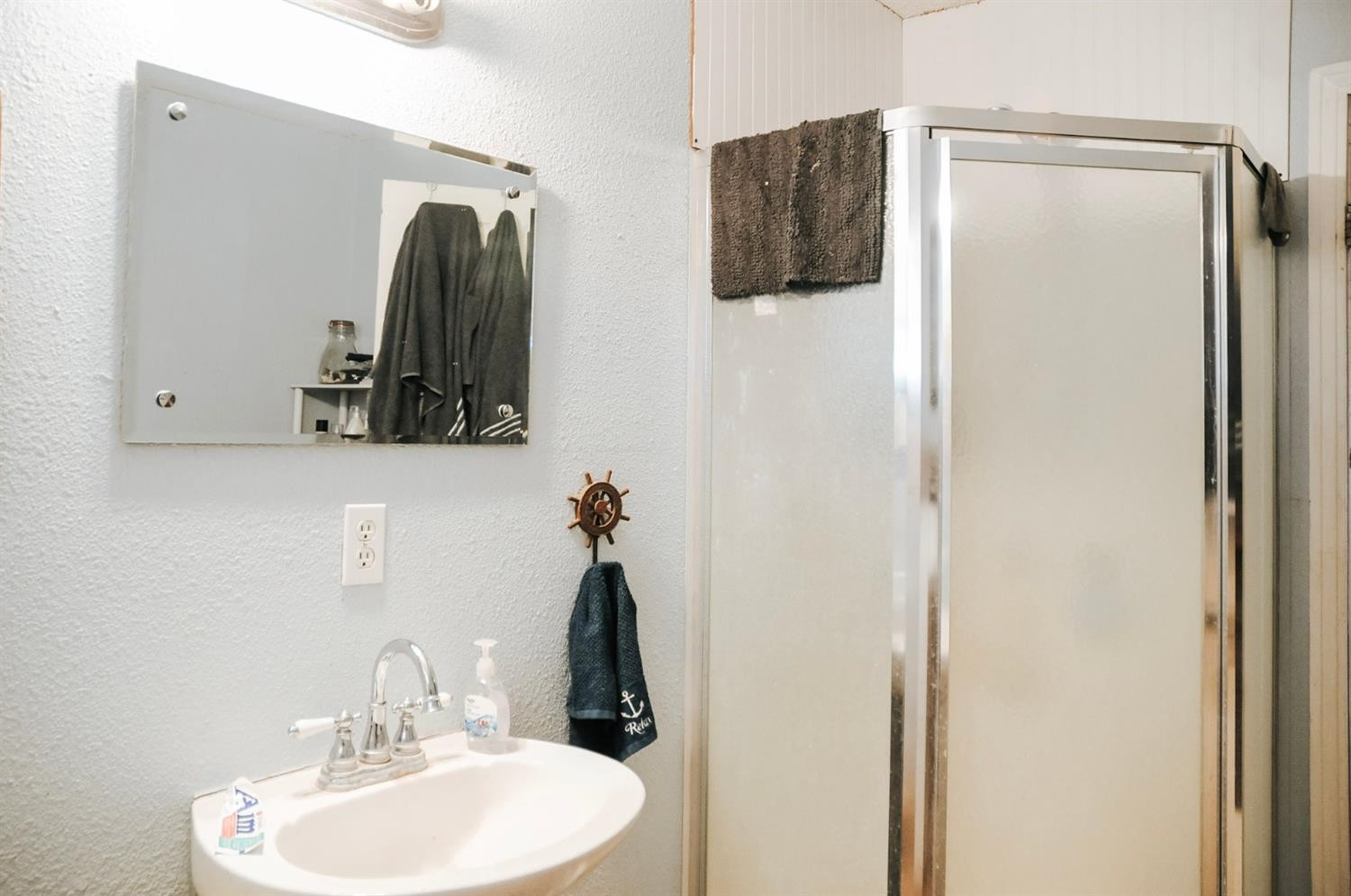 309 Ranch Street Ropesville, TX 79358 - Photo 9 of 26 a bathroom with a sink and mirror